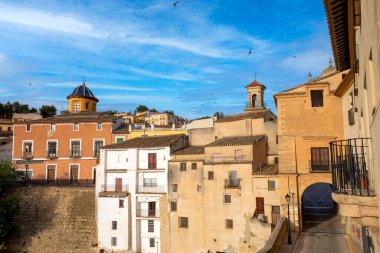 View of the village of Chinchilla de Montearagon in Albacete, Castilla la Mancha, Spain, early in the morning, with historic buildings and church domes and towers clipart