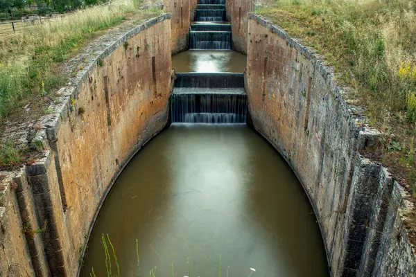 stock image Quadruple lock of the northern canal of Castilla as it passes through Frmista, Palencia, Castilla y Len, Spain seen from its lower part