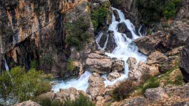 Waterfall that forms the source of the Castril River in the Sierra de Castril Natural Park, Granada, Andalusia, Spain clipart