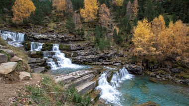 Beautiful waterfall on the Arazas river in the Ordesa y Monte Perdido National Park in the Pyrenees, Huesca, Aragon, Spain clipart