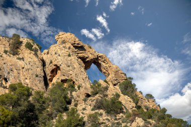 Arch-shaped rock formation in the Ricote Valley, Region of Murcia, Spain clipart