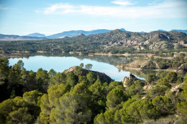 Daylight views of the Alfonso XIII reservoir in Calasparra, Region of Murcia, Spain, where the Quipar river flows clipart