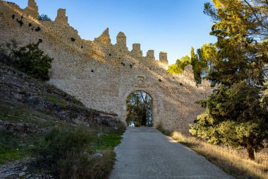 View of the Puerta del Rio in the medieval wall of Alarcon, Cuenca, Castilla-La Mancha, Spain clipart