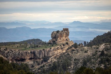 Spectacular view of Benizar Castle, perched on a rock in the town of La Tercia, Moratalla, Murcia Region, Spain.