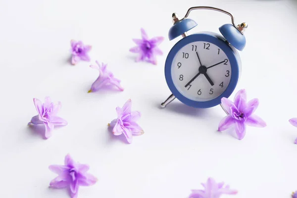 Clock with flower blossom. Spring time banner