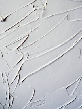 Beyaz boya dokuyu okşar. Soyut arkaplan.