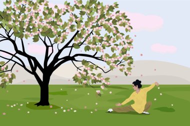 Bir kadın, kiraz çiçeklerinin yanında, dağların arka planında tai chi yapıyor.