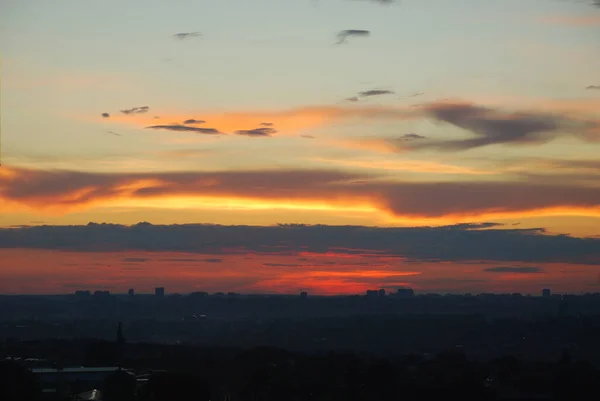 stock image Horizon at sunset. Abstract city landscape background. Red sky with clouds over the city, beautiful panoramic view.