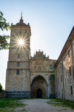 Ayegui, Spain- May 24, 2024: Morning sun shining through the bell tower at the Monastery of Santa Maria de Irachein Ayegui in northern Spain clipart