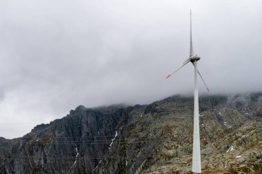 A Wind Turbine on a Swiss mountain pass in the Alps. clipart