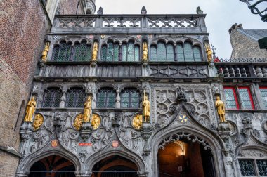 Bruges, Belgium- Sep 27,  2024: The front of the Basilica of the Holy Blood in Bruges. clipart