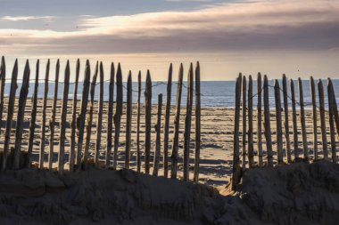 Sunset over the sandy beach in Katwijk, Netherlands