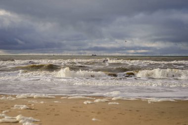 View on the wind turbines at the horizont, from the North sea Katwijk beach, Netherlands