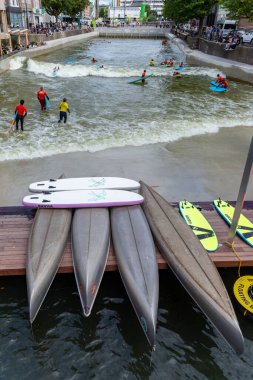 09.08.2024, Rotterdam, Blaak, Netherlands. urban wave pool named RiF010, is located in the heart of Rotterdam, for all surf skill levels, from beginners to experienced surfers clipart