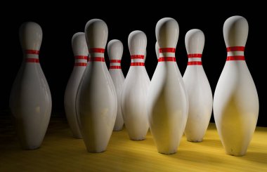 Bowling skittles on a black background on a bowling lane
