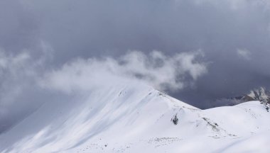 Mountains in snow and fog, snow-white alpine peaks