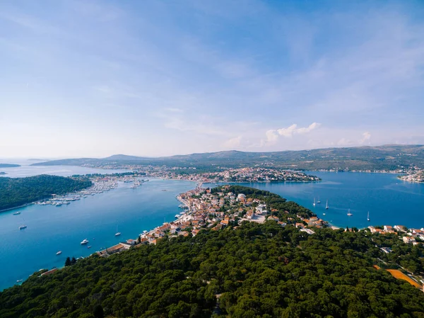 Aerial view of the Adriatic coast, sea, green forest against the blue sky. High quality photo