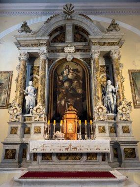 Catholic church altar with icons, statues and columns. High quality photo