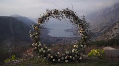 View through the round wedding arch to the Bay of Kotor from the top of the mountain. Montenegro. High quality FullHD footage