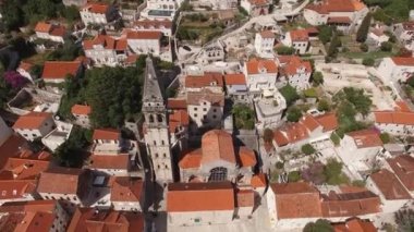 High bell tower of the church of St. Nicholas in Perast. Aerial view. High quality 4k footage