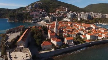 Stone houses with red roofs behind high fortress walls in old Budva. Montenegro. High quality 4k footage