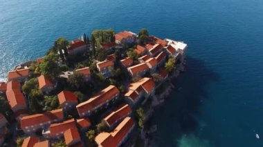 Boats are moored near the isthmus of the island of Sveti Stefan. Drone. High quality 4k footage