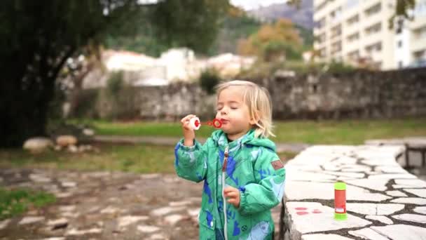 Little Girl Overalls Spitting While Trying Blow Soap Bubbles High — Vídeo de Stock
