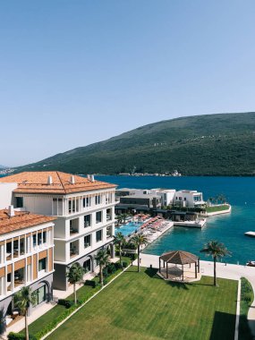 Modern hotel complex with private beaches and swimming pools on the seashore. High quality photo