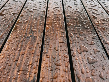 Large drops of rain on a wooden surface. Close-up. High quality photo