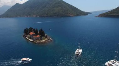 Yachts sail near the island of Saint George. Montenegro. High quality 4k footage