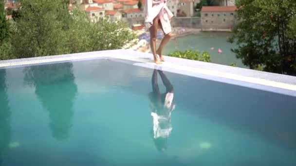 Girl Walks Edge Pool Background Red Roofs Old Houses High — Stockvideo