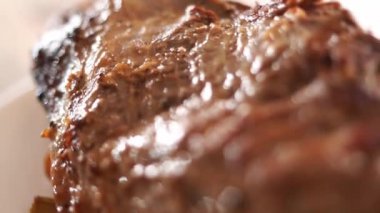 Juicy roast beef with spices lies on a plate. High quality FullHD footage