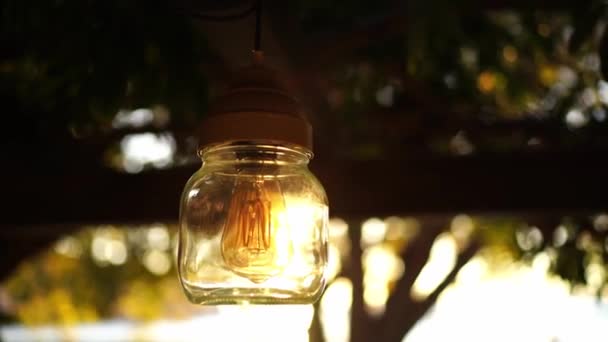Incandescent Lamp Jar Hangs Pergola Beam Garden Reflections Sun High — Wideo stockowe