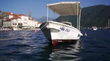 Covered motorboat is moored at the Perast pier. Montenegro. High quality FullHD footage