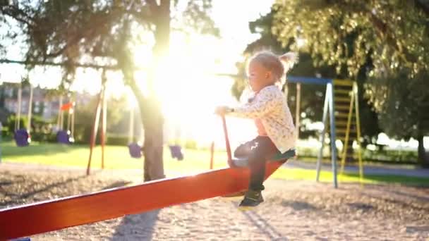 Little Girl Swings Swing Balancer Playground High Quality Footage — Vídeo de Stock