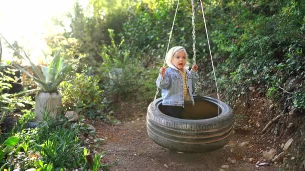 Little Girl Swinging Tire Swing Park High Quality Footage — Vídeos de Stock