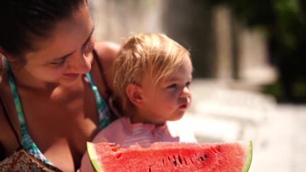 Mom Little Girl Her Arms Eat Piece Watermelon High Quality — Vídeos de Stock