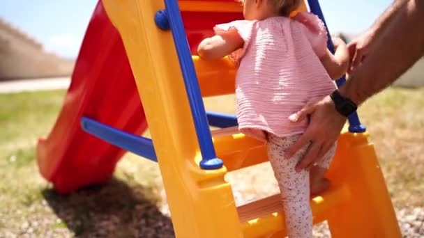 Dad Lifts Little Girl Steps Slide High Quality Fullhd Footage — Wideo stockowe