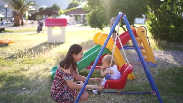 Mom Swings Little Girl Swing Playground High Quality Fullhd Footage — Wideo stockowe