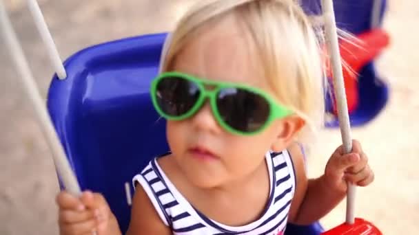 Little Girl Sunglasses Swings Back Forth Rope Swing High Quality — ストック動画