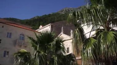 Facade of the Church of St. Mark the Apostle among the old houses in Perast. Montenegro. High quality FullHD footage