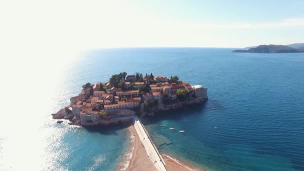 Island Sveti Stefan Ancient Buildings Surrounded Fortress Walls Blue Sea — Stok video