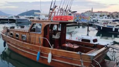 Wooden motor yacht moored to the shore. High quality FullHD footage