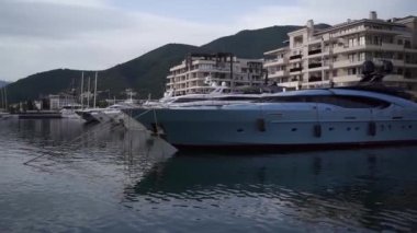 Exclusive yachts are moored to the pier. Porto, Montenegro. High quality FullHD footage