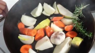 Chef stacks chopped vegetables on a steaming pan. High quality 4k footage