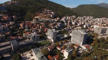 Modern high-rise buildings of the new Budva against the backdrop of mountains. Montenegro. High quality 4k footage
