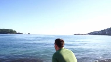 Dad throws a little girl high in his arms and tickles her tummy. High quality 4k footage