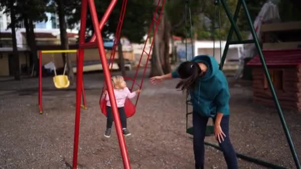 Mom Swings Little Girl Swing Playground High Quality Footage — Wideo stockowe