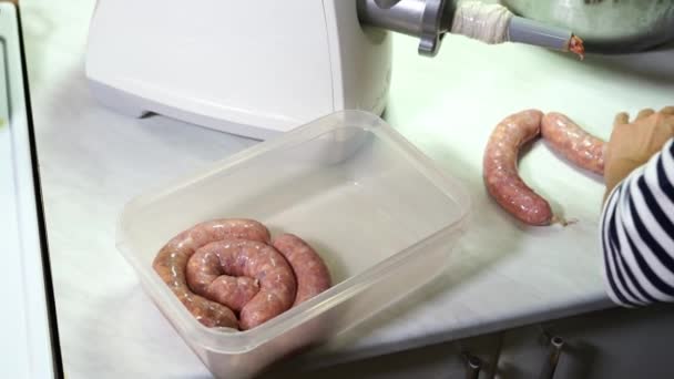 Housewife Bundles Meat Filled Sausages Puts Them Box High Quality — Stockvideo