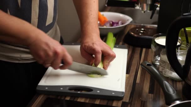 Chef Cuts Celery Knife Cutting Board High Quality Footage — Stockvideo